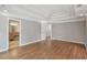 Spacious main bedroom with trey ceiling, hardwood floors, and ensuite bathroom access at 220 Chinkapin Sw Cir, South Fulton, GA 30311