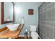 Stylish bathroom featuring a vessel sink, decorative mirror, and modern fixtures at 2694 Greentree Se Dr, Marietta, GA 30067