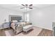 Comfortable bedroom with a decorative bedframe, soft lighting, and a neutral color scheme at 2694 Greentree Se Dr, Marietta, GA 30067
