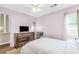 This bedroom is airy and bright with natural light and ceiling fan at 2694 Greentree Se Dr, Marietta, GA 30067
