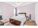 Bright bedroom featuring neutral colors, updated flooring, and a ceiling fan at 2694 Greentree Se Dr, Marietta, GA 30067