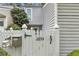 Exterior of cozy townhome featuring white picket fence with stylish black accents at 2694 Greentree Se Dr, Marietta, GA 30067
