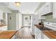 Bright kitchen with wood countertops, white cabinets and modern appliances, plus an outdoor view at 2694 Greentree Se Dr, Marietta, GA 30067