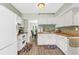 Bright kitchen with white cabinetry, butcher block countertops, and modern appliances at 2694 Greentree Se Dr, Marietta, GA 30067