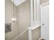 Hallway with white banister staircase, and pendant lighting at 2694 Greentree Se Dr, Marietta, GA 30067