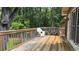 Back deck with white chairs and table overlooking wooded area at 4807 Greenway Rd, Norcross, GA 30071