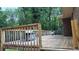 Spacious back deck with wood railing overlooking lush trees at 4807 Greenway Rd, Norcross, GA 30071