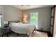Serene bedroom with a cozy bed, bedside tables, and hardwood flooring at 4807 Greenway Rd, Norcross, GA 30071