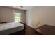 Bedroom with ceiling fan, wood floors, and natural light from the window at 4807 Greenway Rd, Norcross, GA 30071