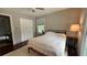 Bedroom with hardwood floors, closet, fan and natural light from the windows at 4807 Greenway Rd, Norcross, GA 30071