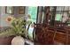 Elegant dining room details: A china cabinet and fresh flowers create an inviting atmosphere at 4807 Greenway Rd, Norcross, GA 30071