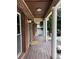 Covered front porch with elegant columns, offering a shaded entryway and classic curb appeal at 4807 Greenway Rd, Norcross, GA 30071