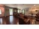 Spacious living room featuring hardwood floors, a fireplace, and an open floor plan to the dining area at 4807 Greenway Rd, Norcross, GA 30071