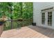 Wooden deck with access to the home's french doors and backyard at 3801 Stonebriar Ln, Duluth, GA 30097