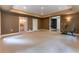 Spacious basement with carpet flooring and access to a bathroom with vanity and walk-in closet at 3801 Stonebriar Ln, Duluth, GA 30097
