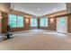 Spacious basement with carpet flooring, recessed lighting, multiple windows and access to the outside at 3801 Stonebriar Ln, Duluth, GA 30097
