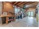 Unfinished basement space featuring a work bench, shelving, and drop ceiling at 3801 Stonebriar Ln, Duluth, GA 30097
