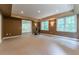 Expansive carpeted basement with recessed lights, multiple windows, and neutral colored walls at 3801 Stonebriar Ln, Duluth, GA 30097