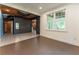 Finished basement space features neutral floors, open ceiling, and accent wall at 3801 Stonebriar Ln, Duluth, GA 30097