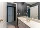 Vanity area with a sink, large mirror, and views to the shower and door at 3801 Stonebriar Ln, Duluth, GA 30097