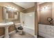 Traditional style bathroom featuring a shower-tub combo, pedestal sink and granite counter vanity at 3801 Stonebriar Ln, Duluth, GA 30097