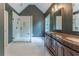 Bathroom featuring glass shower, marble tile and a large vanity with granite countertop at 3801 Stonebriar Ln, Duluth, GA 30097