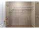 Walk-in closet featuring carpet flooring and adjustable wire shelving units at 3801 Stonebriar Ln, Duluth, GA 30097