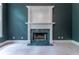 Close up of the fireplace with green marble and white mantle at 3801 Stonebriar Ln, Duluth, GA 30097