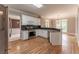 Bright, eat-in kitchen features stainless steel appliances, granite counters, and hardwood floors at 3801 Stonebriar Ln, Duluth, GA 30097