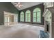 Spacious living room with large windows, a fireplace, and hardwood floors in the entry at 3801 Stonebriar Ln, Duluth, GA 30097