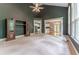 Large living room with built-in cabinets, arched windows and access to the kitchen at 3801 Stonebriar Ln, Duluth, GA 30097