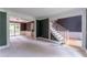 Spacious living room with stairs, carpet floors and classic columns at 3801 Stonebriar Ln, Duluth, GA 30097