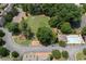 Comprehensive aerial view showcases community amenities, including a pool, fire pit, and lush green spaces at 460 Chowning Nw Pl, Marietta, GA 30064