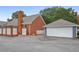View of the brick patio, detached garage and privacy fence from the back of the house at 460 Chowning Nw Pl, Marietta, GA 30064