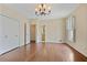 Bedroom featuring hardwood floors, an ensuite bathroom, and double closets at 460 Chowning Nw Pl, Marietta, GA 30064