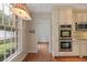 Bright kitchen area featuring stainless steel double oven and hardwood floors at 460 Chowning Nw Pl, Marietta, GA 30064