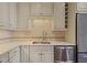 Well-equipped kitchen with stainless steel appliances and white cabinetry at 460 Chowning Nw Pl, Marietta, GA 30064