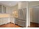 Modern kitchen with stainless steel refrigerator and white cabinets at 460 Chowning Nw Pl, Marietta, GA 30064