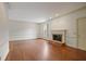 Bright living room with hardwood floors and a cozy brick fireplace at 460 Chowning Nw Pl, Marietta, GA 30064
