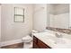 Bathroom with a white vanity, shower, and earth-toned tile at 726 Independence Ln, Acworth, GA 30102