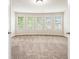 Bedroom with wall-to-wall carpeting and a set of windows providing natural light at 726 Independence Ln, Acworth, GA 30102