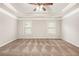 Spacious bedroom features wall-to-wall carpeting, with a decorative tray ceiling and a ceiling fan at 726 Independence Ln, Acworth, GA 30102
