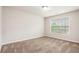 Bedroom with neutral carpet and natural light from large window at 726 Independence Ln, Acworth, GA 30102