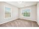 Bright bedroom with two large windows, neutral carpet, and plenty of natural light at 726 Independence Ln, Acworth, GA 30102