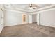 Spacious bedroom features wall-to-wall carpeting, with a decorative tray ceiling and a ceiling fan at 726 Independence Ln, Acworth, GA 30102