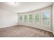 Bedroom with wall-to-wall carpeting and four windows providing plenty of natural light at 726 Independence Ln, Acworth, GA 30102