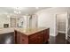 Kitchen island with granite countertop and open access to additional spaces at 726 Independence Ln, Acworth, GA 30102