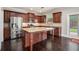 Spacious kitchen featuring stainless steel appliances, granite countertops, and a center island with barstool seating at 726 Independence Ln, Acworth, GA 30102