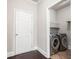 Convenient laundry room with modern washer and dryer units and ample storage space at 726 Independence Ln, Acworth, GA 30102