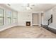 Spacious living room with neutral walls, fireplace, and large windows providing natural light at 726 Independence Ln, Acworth, GA 30102